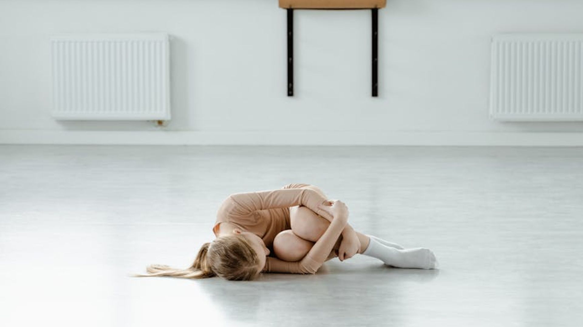 Serene yoga studio with natural light and minimalist decor.